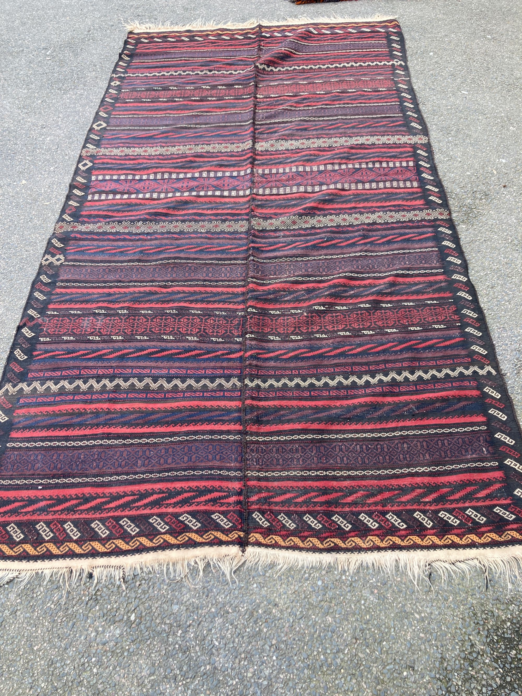 A Kelim flatweave carpet, 372 x 176cm